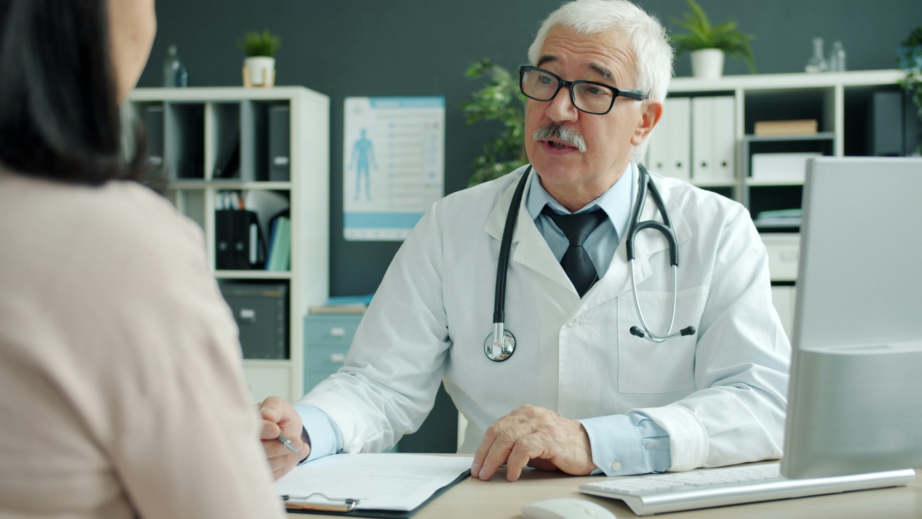 Healthcare professional consulting a patient